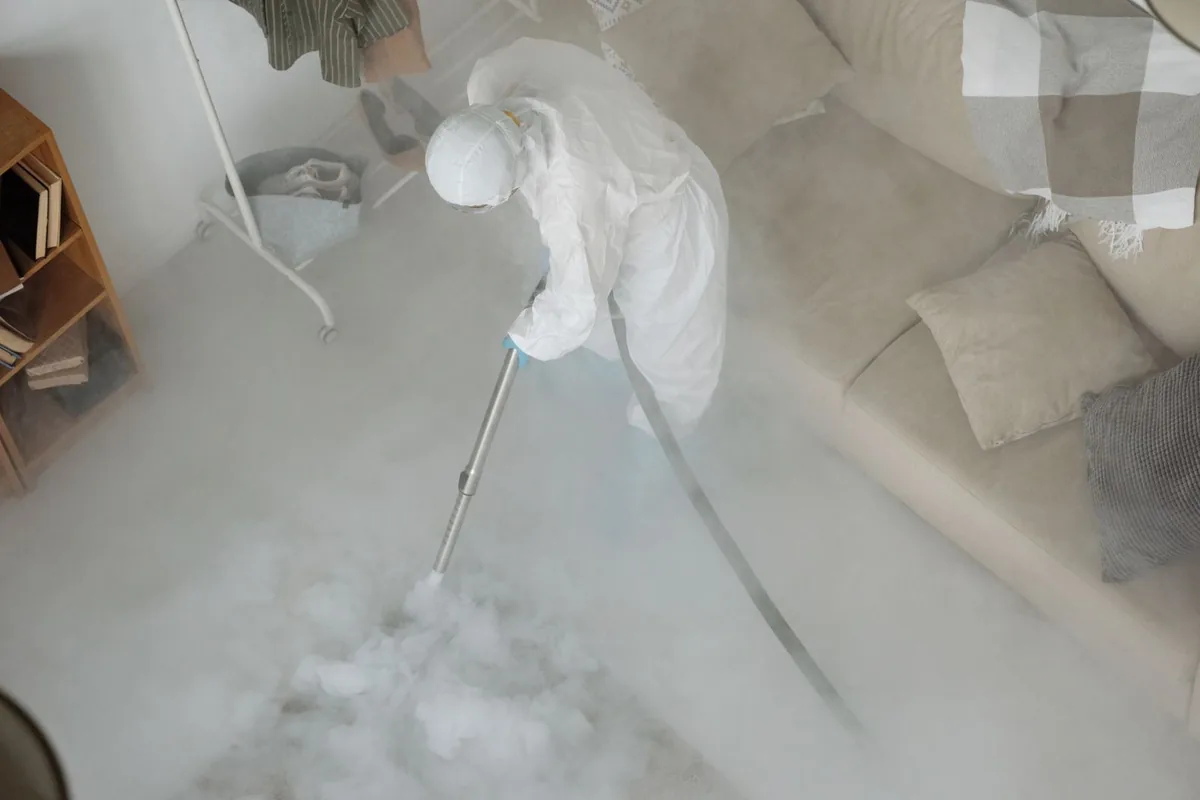 Biohazard cleanup technician in protective equipment, Massillon, OH